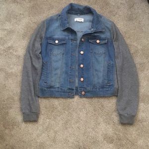Denim jacket with gray fabric sleeves